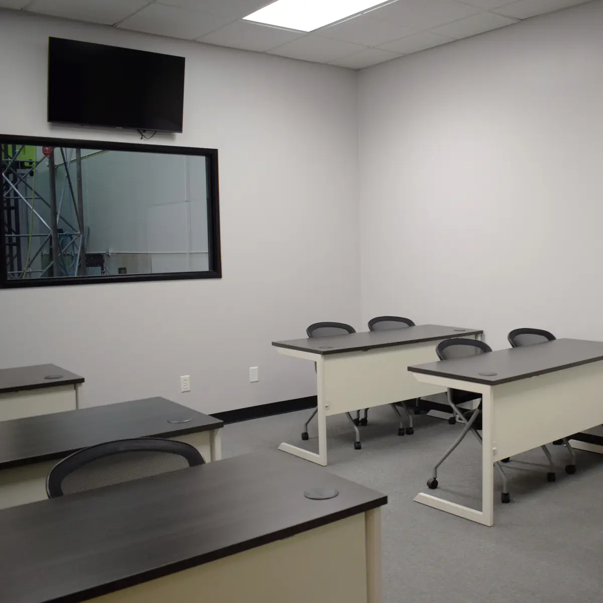 Roadrunner Classroom, with a window into the training bay