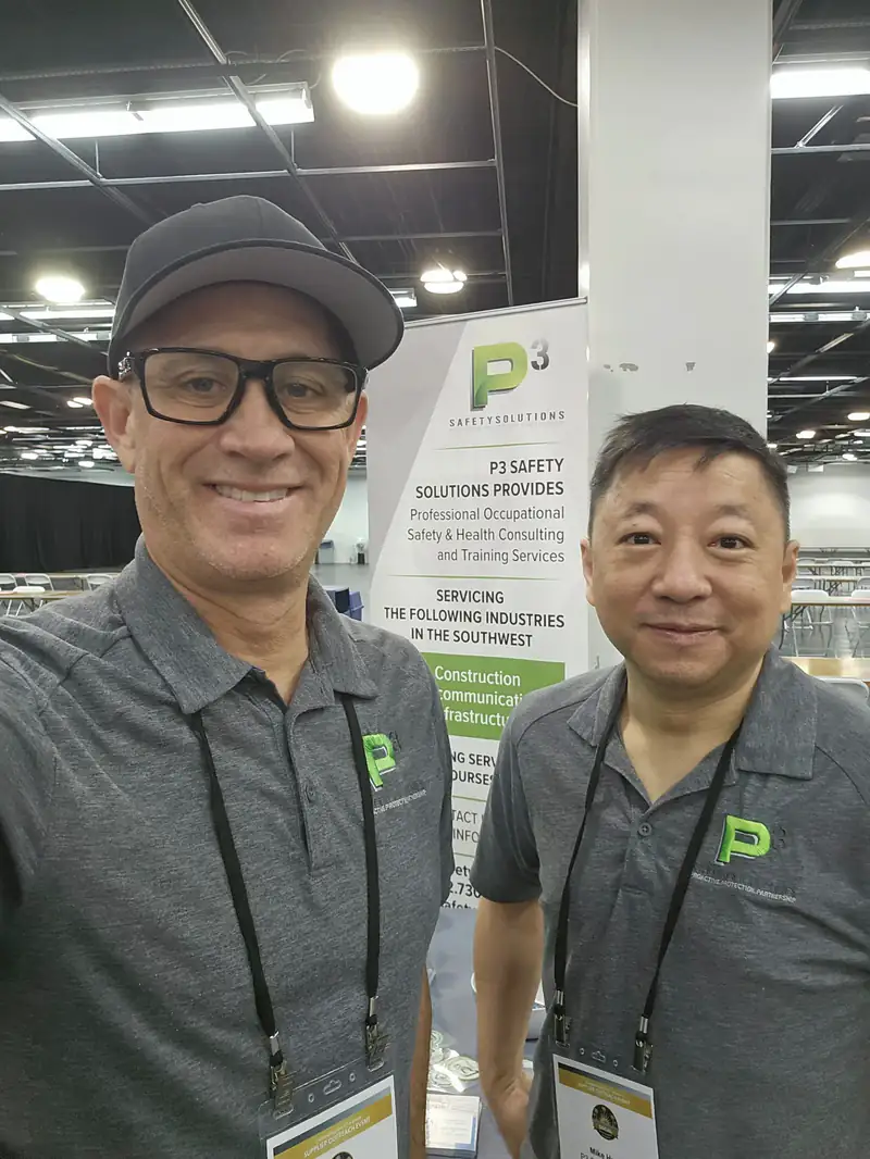 Two P3 Safety Solutions team members at the company booth at a trade show
