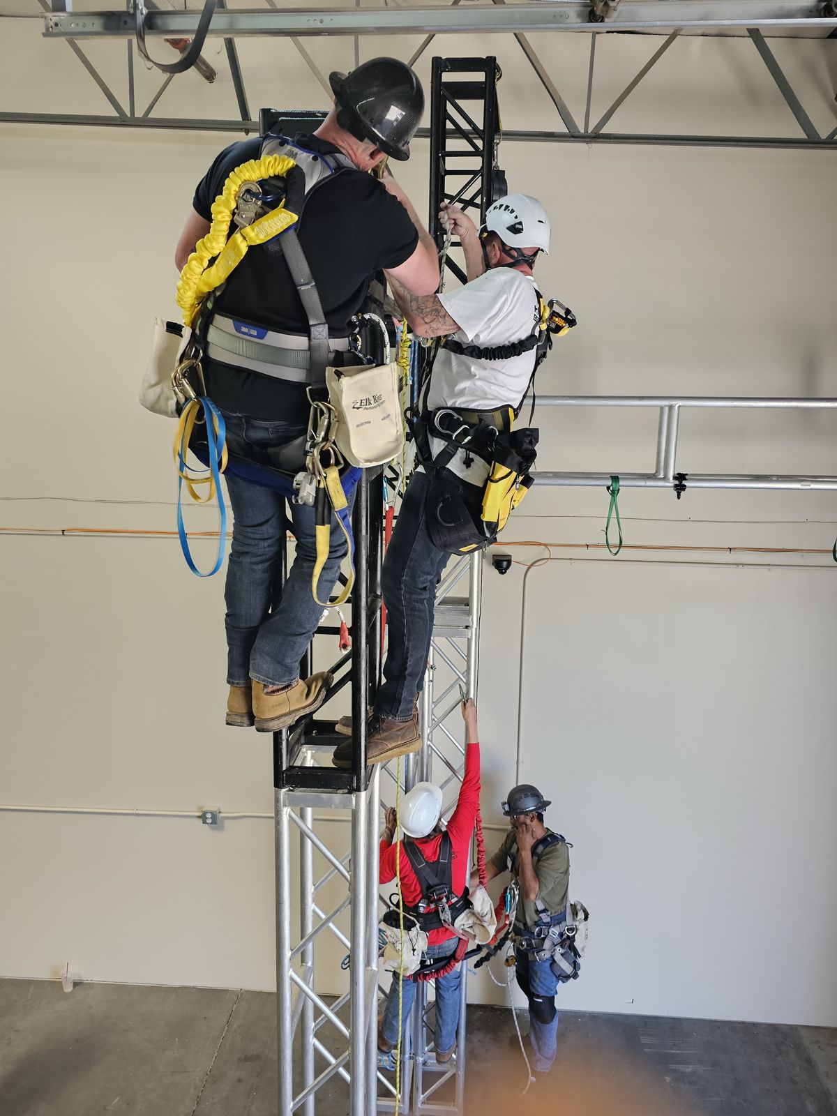 Climbers on the training structure